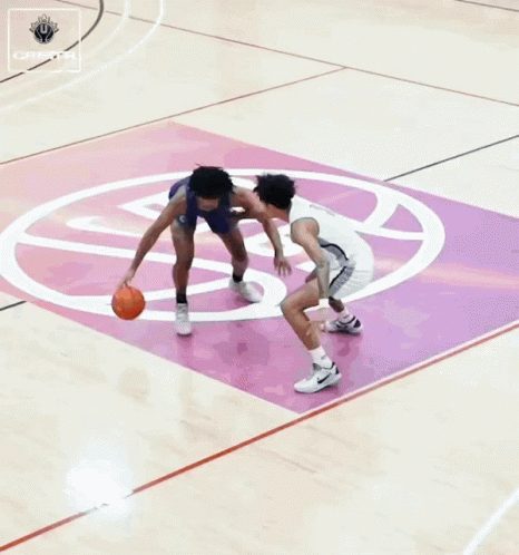 Basketball Player Number 6 Blocking Player Number 3