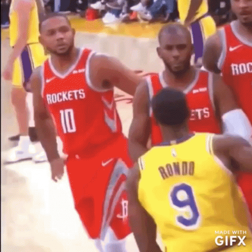 Basketball Player Number 9 Beside Another Player