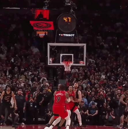 Basketball Player Number 9 in Front of Crowd
