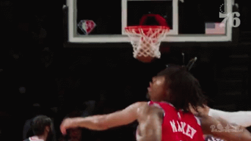 Basketball Player Preparing to Dunk