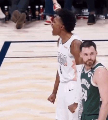 Basketball Player Screaming In The Air With Opponent GIF