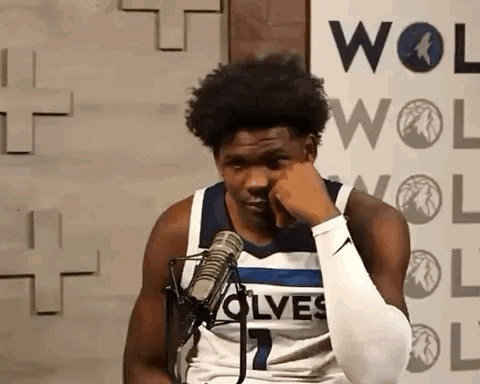 Basketball Player Sitting at Microphone