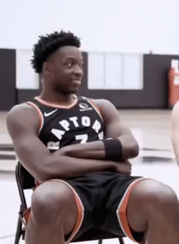 Basketball Player Sitting in Chair Arms Crossed