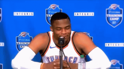 Basketball Player Sitting In Front Of Microphone Eyes Closed GIF