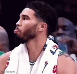 Basketball Player Sitting in Stadium