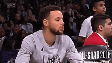 Basketball Player Sitting in Stands