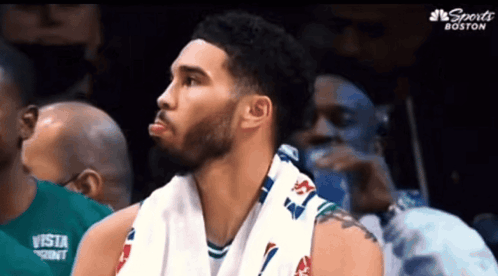 Basketball Player Sitting in Stands