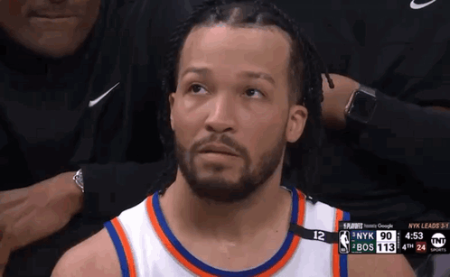 Basketball Player Sitting in Stands