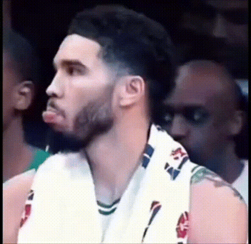 Basketball Player Sitting in Stands
