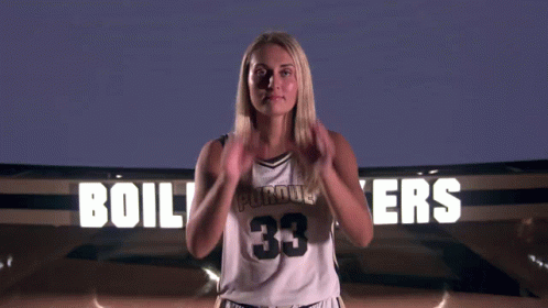 Basketball Player Standing in Stands During Game