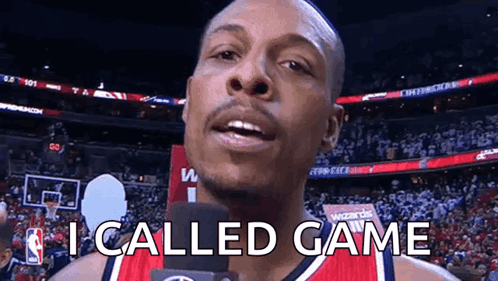 Basketball Player Talking Into Microphone in Red Jersey