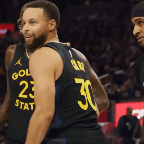 Basketball Player Wearing A Black Jersey With The Number 30 On The Back GIF