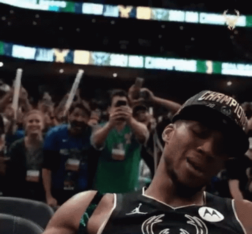 Basketball Player Wearing Champions Hat