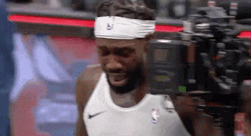 Basketball Player Wearing Headband And Tank Top GIF
