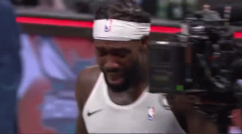 Basketball Player Wearing Headband And White Shirt GIF