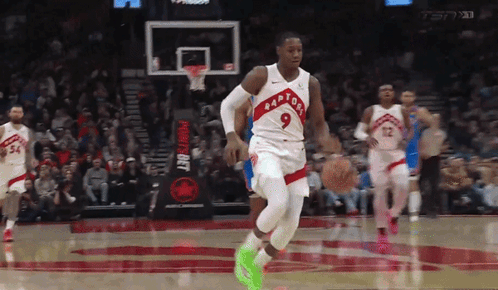 Basketball Player Wearing Number 9 Dribbling GIF