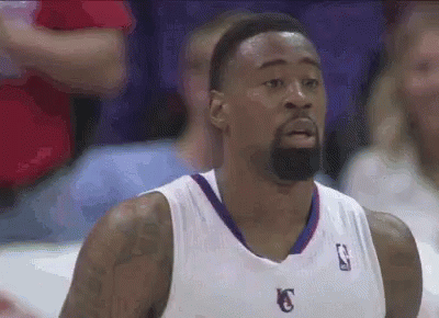 Basketball Player With Beard in White Jersey With Letter K