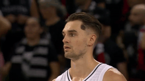 Basketball Player With Forehead Tattoo Looks at Camera