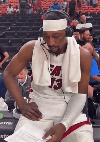 Basketball Player With Headphones and Towel Number 13