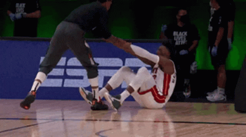 Basketball Player With Knee Injury Helped By Referee GIF