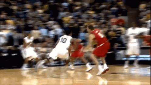 Basketball Player With Number 10 Dribbling Ball