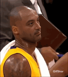 Basketball Player With Towel Around Neck And Gifstar Logo GIF