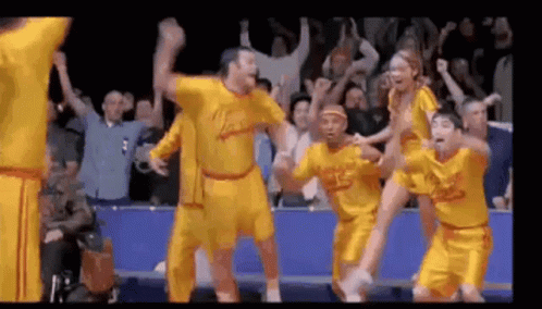 Basketball Players Dancing in Front of Crowd