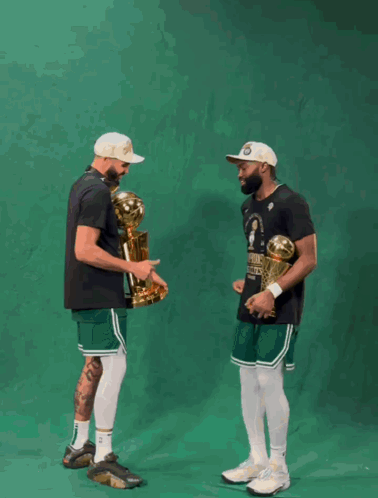 Basketball Players Holding Boston Celtics Trophy GIF