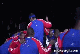 Basketball Players Huddled with Number 24