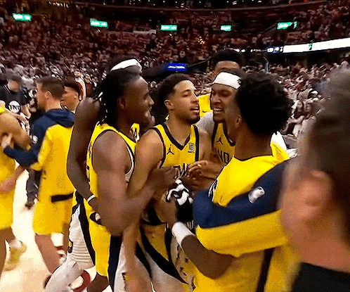 Basketball Players Hugging, One With NC Jersey GIF