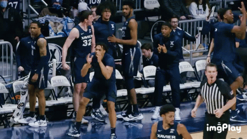 Basketball Players in Blue Xavier Uniforms