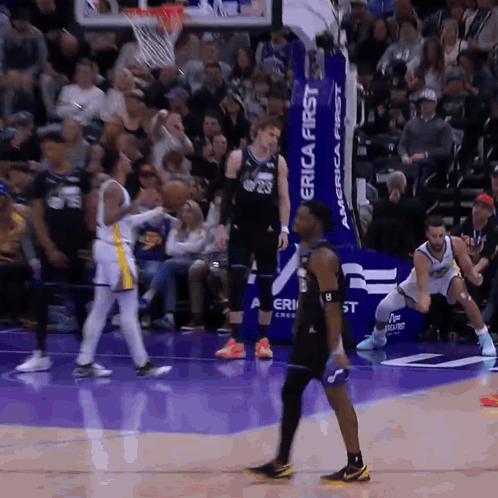 Basketball Players On A Court With A Banner That Says Erica First GIF