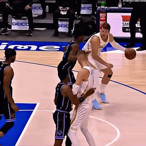 Basketball Players On A Court With The Word Geico In The Background GIF