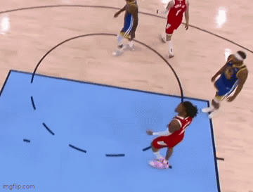 Basketball Players Playing on Blue Court