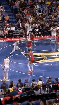 Basketball Players Playing on Court