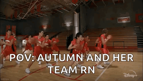 Basketball Players Playing on Court in Gym