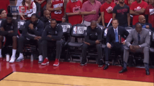 Basketball Players Sitting in Stands