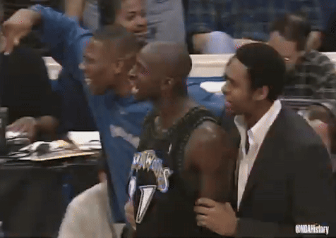 Basketball Players Standing In A Crowd GIF