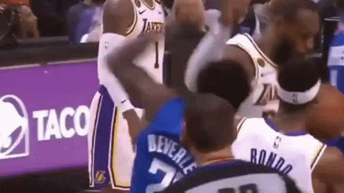 Basketball Players Standing Near Taco Sign GIF