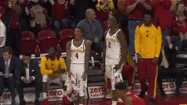 Basketball Players Standing Next to Each Other