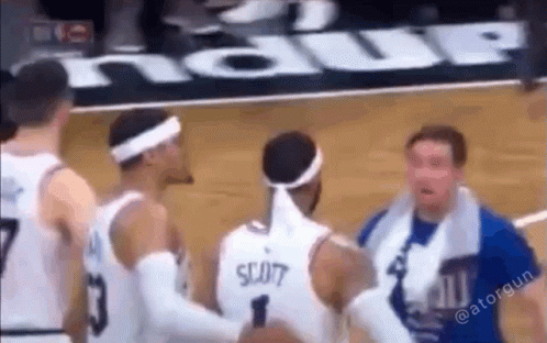 Basketball Players Standing on Court