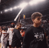 Basketball Players Walking Off Court
