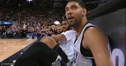 Basketball Players Watching Game