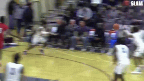 Basketball Slam in Front of Crowd