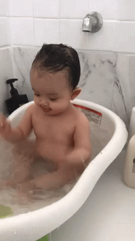 Cute Baby Plays During Bath GIF