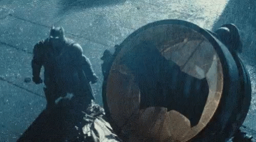 Batman and Robin Fighting in Rain