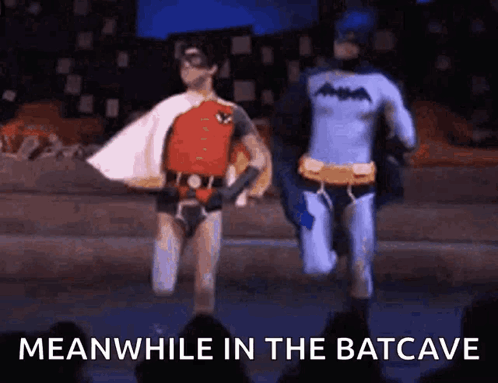 Batman and Robin Running on Stage Meanwhile in the Batcave