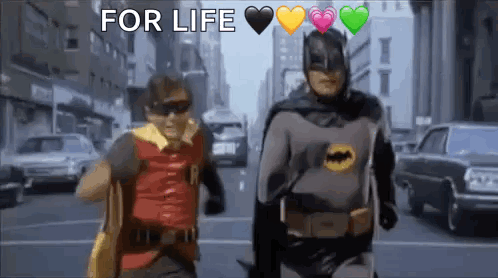 Batman and Robin Walking Down City Street With Hearts