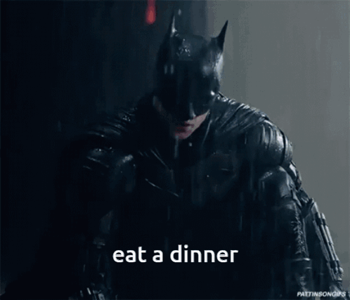 Batman Eating Dinner in the Rain
