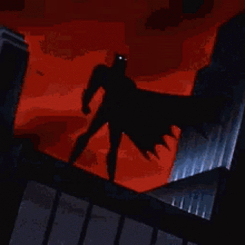 Batman Standing on Building with Blue Cape